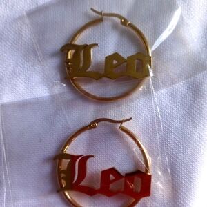 Leo sign brand new gold colored earrings